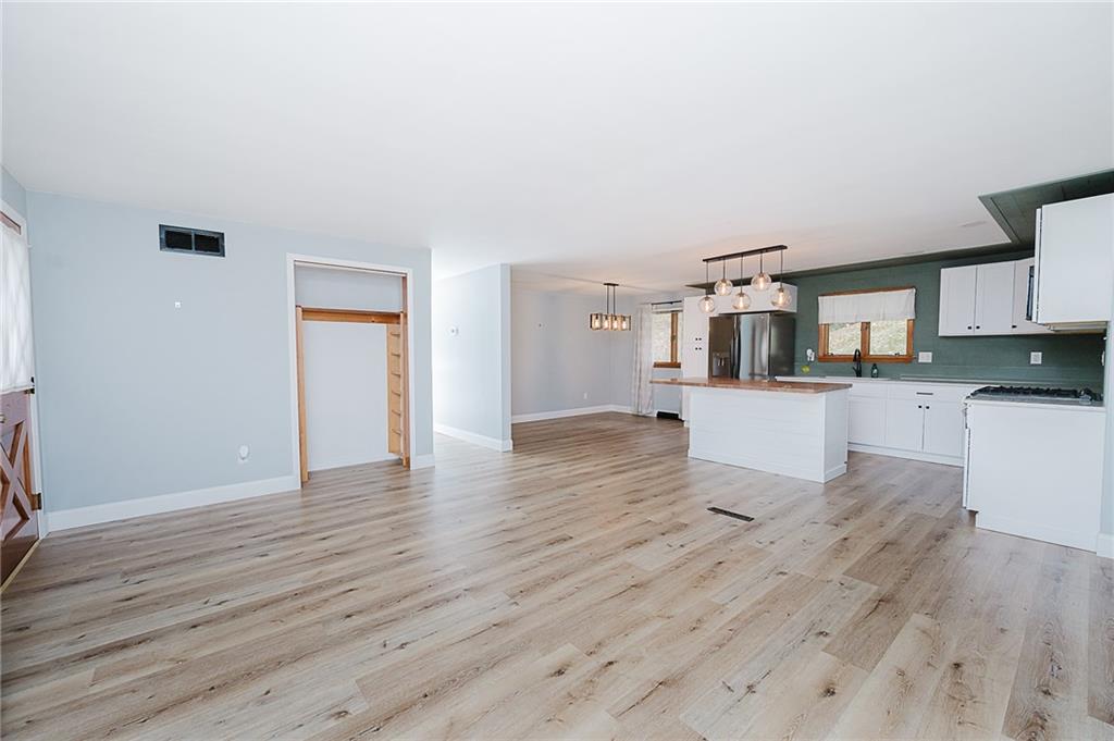 89 Marcoline Road Home, PA 15747 - Photo 11 of 47 a view of a kitchen with wooden floor and electronic appliances