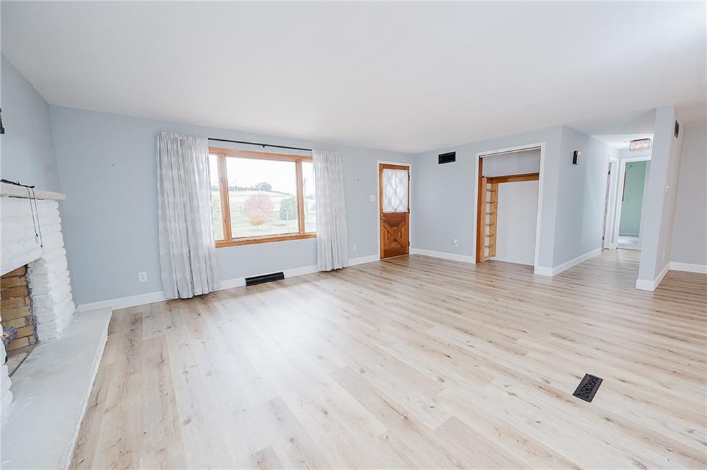 89 Marcoline Road Home, PA 15747 - Photo 15 of 47 an empty room with wooden floor and windows