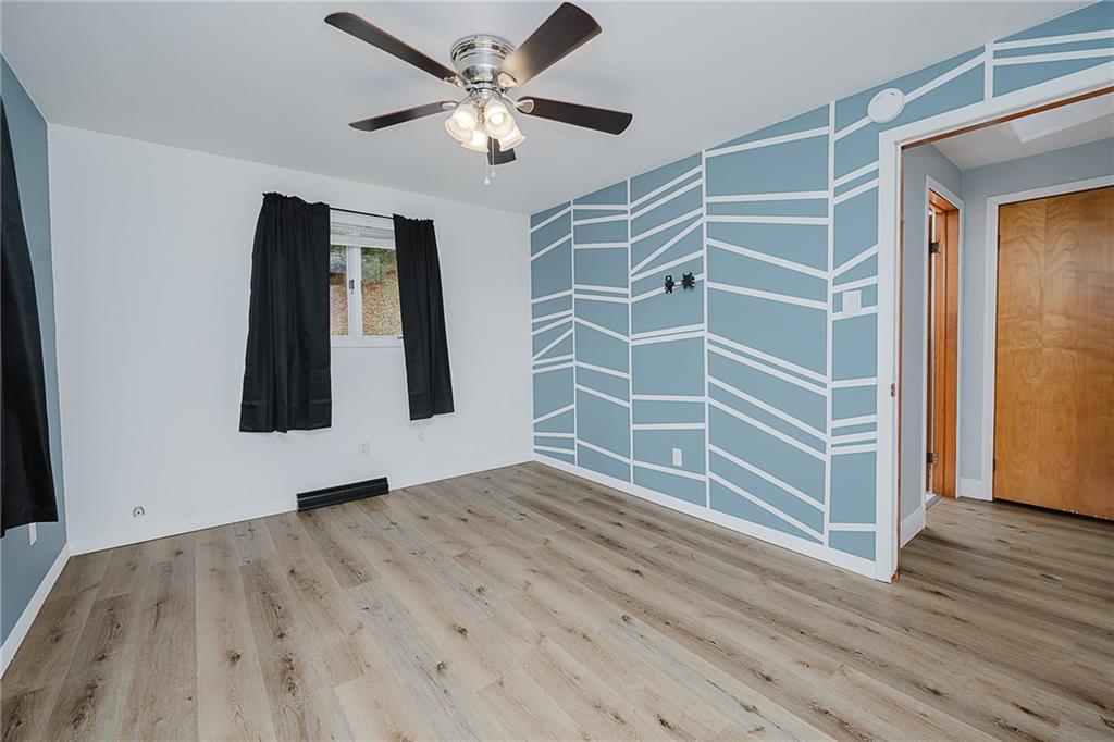 89 Marcoline Road Home, PA 15747 - Photo 16 of 47 wooden floor in an empty room with a window