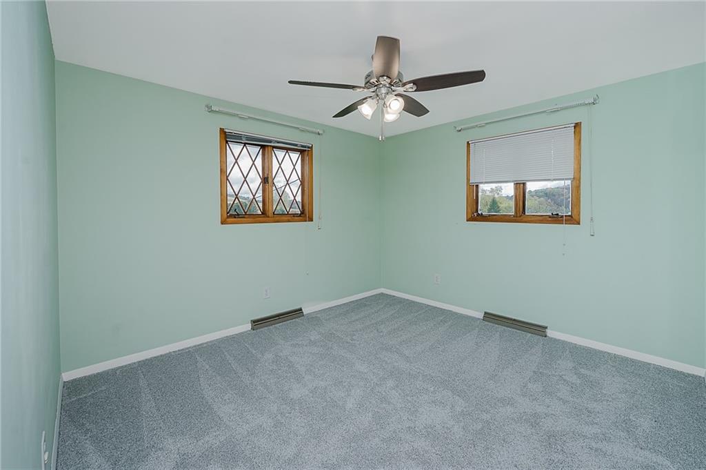 89 Marcoline Road Home, PA 15747 - Photo 18 of 47 a view of an empty room with a window