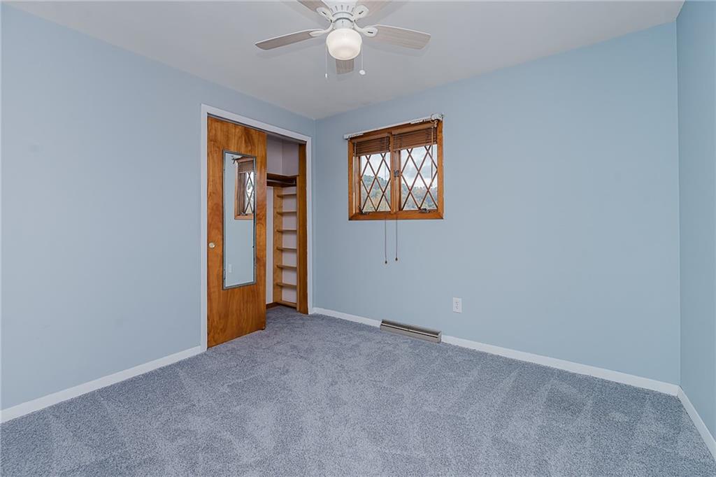 89 Marcoline Road Home, PA 15747 - Photo 20 of 47 an empty room with closet and windows