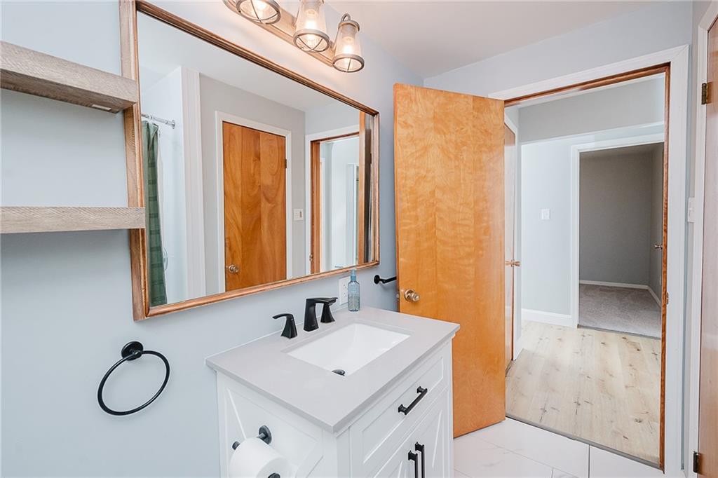 89 Marcoline Road Home, PA 15747 - Photo 23 of 47 a bathroom with a sink a mirror and a shower