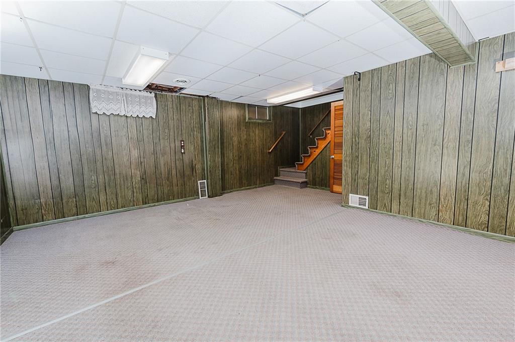 89 Marcoline Road Home, PA 15747 - Photo 24 of 47 a view of empty room with wooden walls