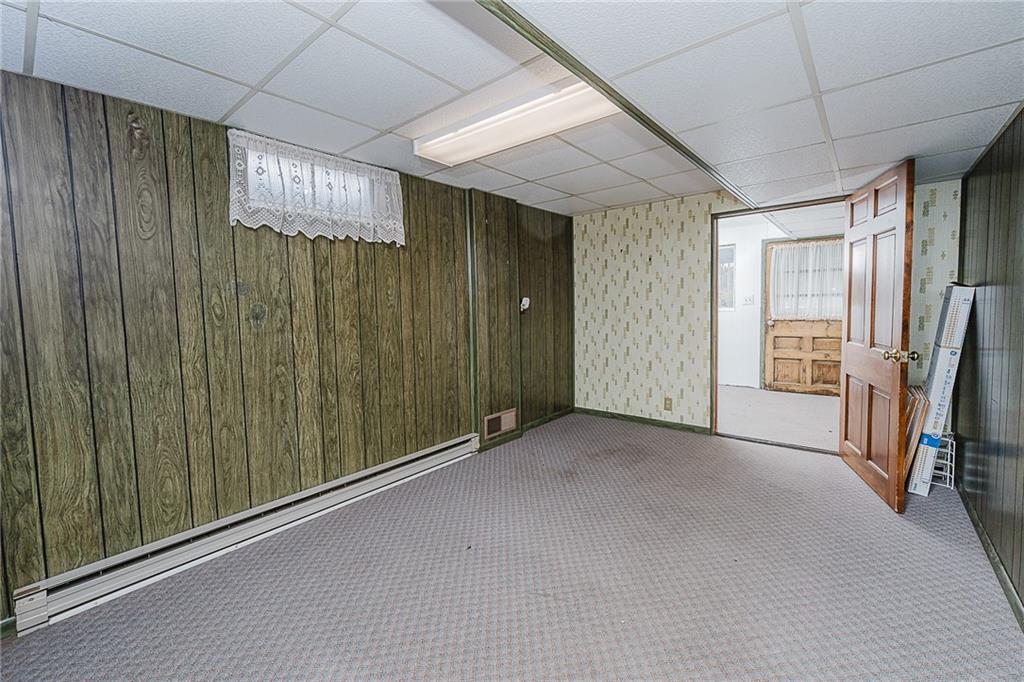 89 Marcoline Road Home, PA 15747 - Photo 26 of 47 a view of a hallway with a refrigerator