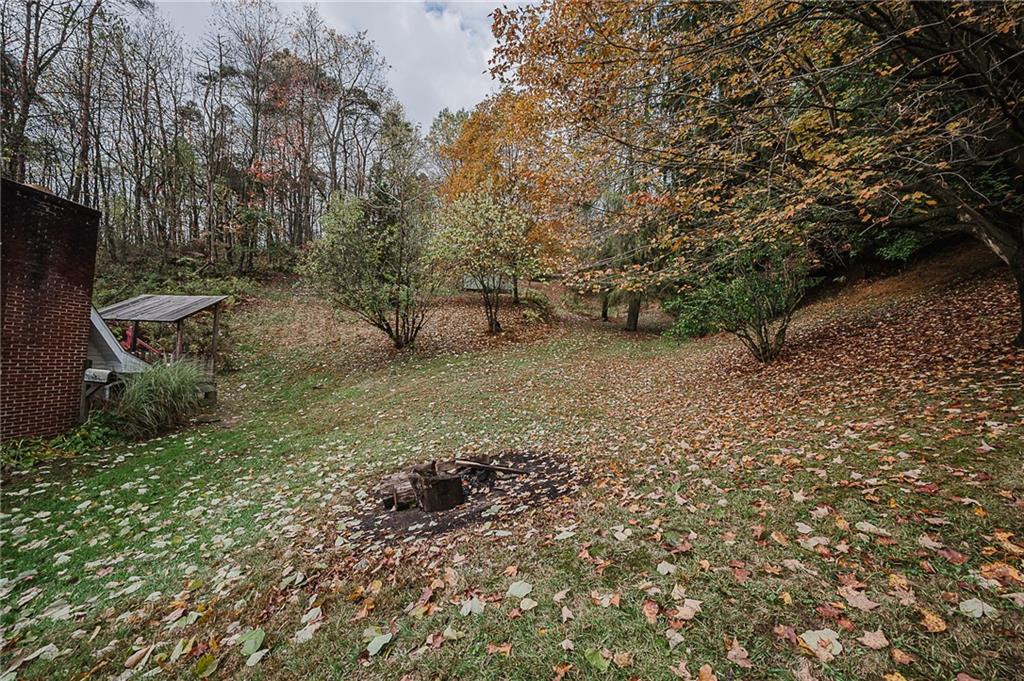89 Marcoline Road Home, PA 15747 - Photo 36 of 47 a backyard of a house with lots of green space