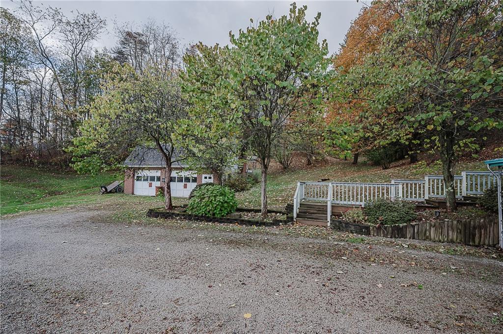 89 Marcoline Road Home, PA 15747 - Photo 38 of 47 a view of a house with a yard and large trees