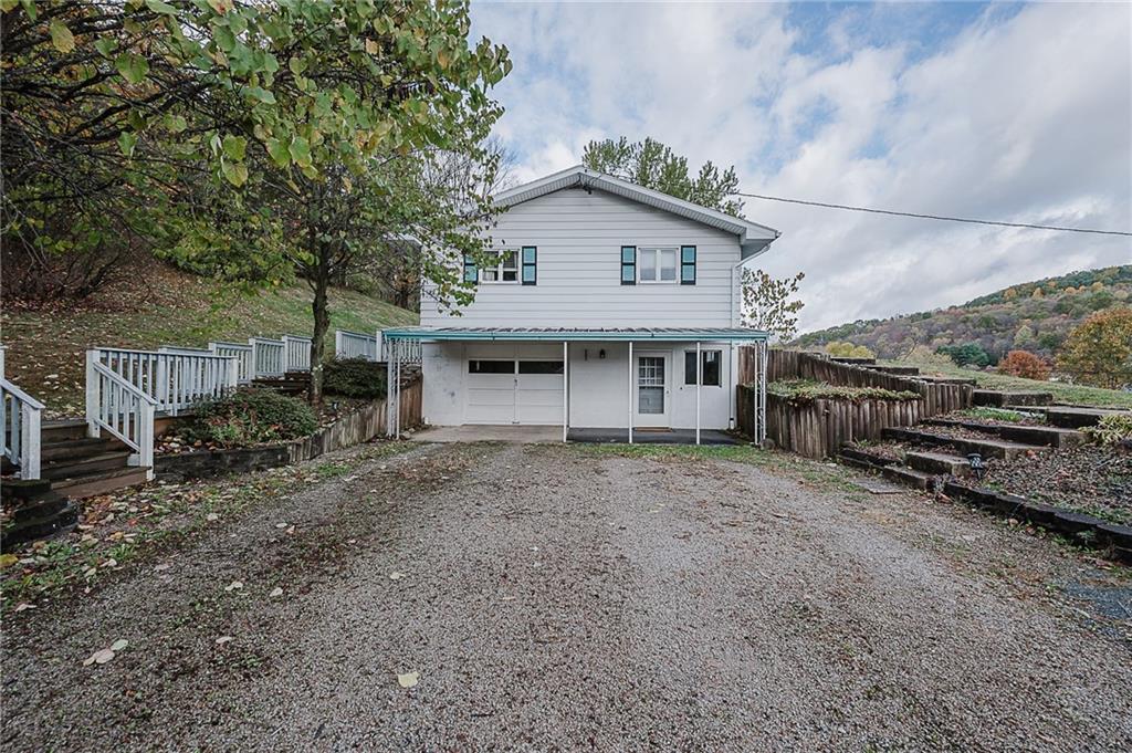 89 Marcoline Road Home, PA 15747 - Photo 40 of 47 a view of a house with a yard and wooden fence