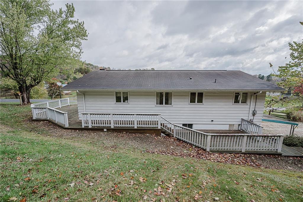 89 Marcoline Road Home, PA 15747 - Photo 42 of 47 a view of a house with a big yard and large tree