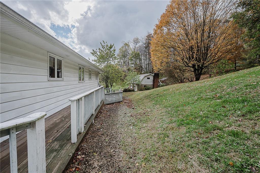 89 Marcoline Road Home, PA 15747 - Photo 45 of 47 a view of a house with a yard