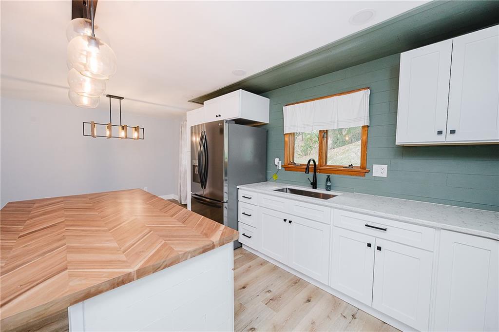 89 Marcoline Road Home, PA 15747 - Photo 6 of 47 a kitchen with stainless steel appliances white cabinets and a refrigerator