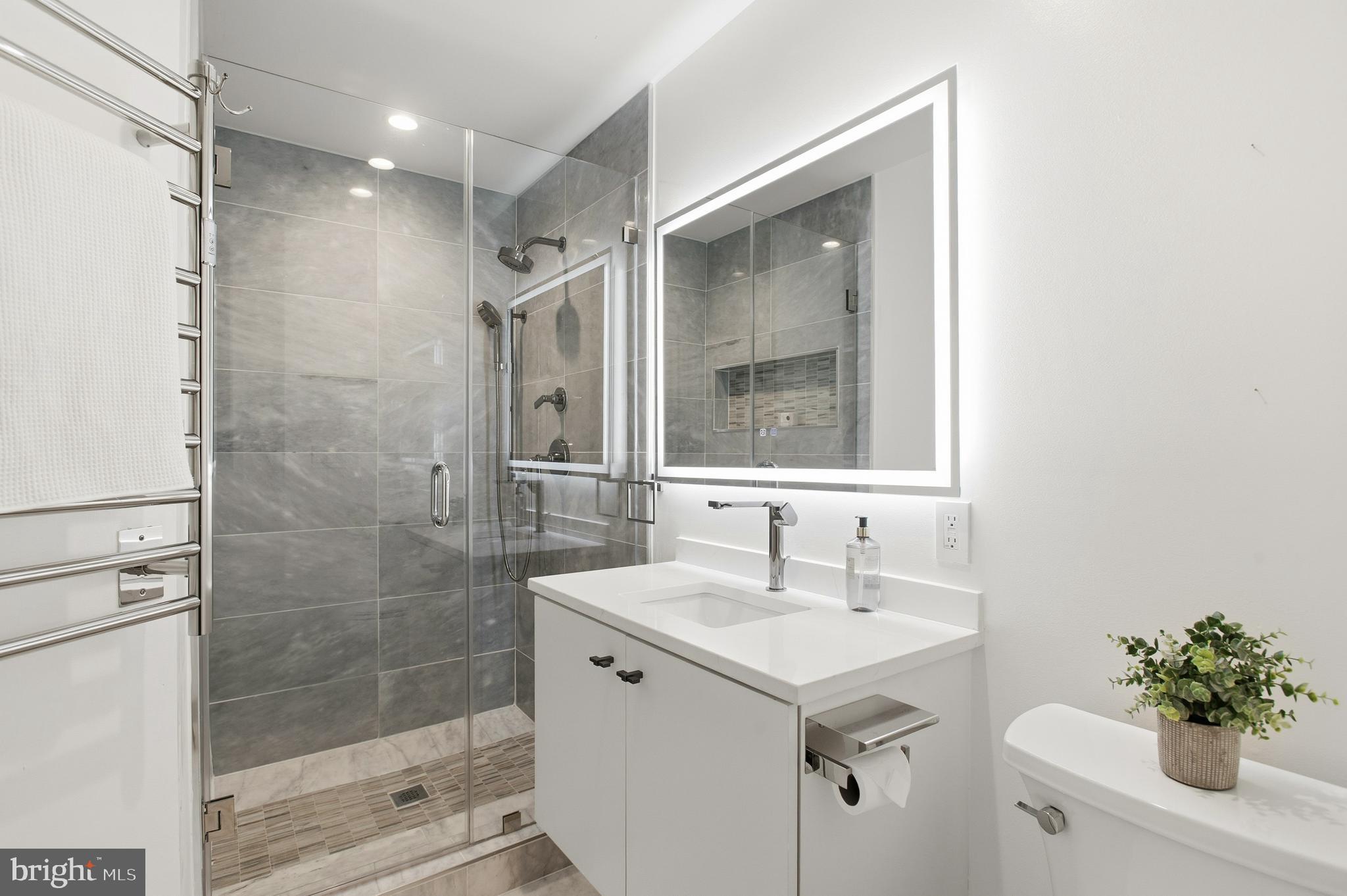 3001 Foxhall Road Northwest Washington, DC 20016 - Photo 20 of 51 a bathroom with a shower sink vanity and mirror