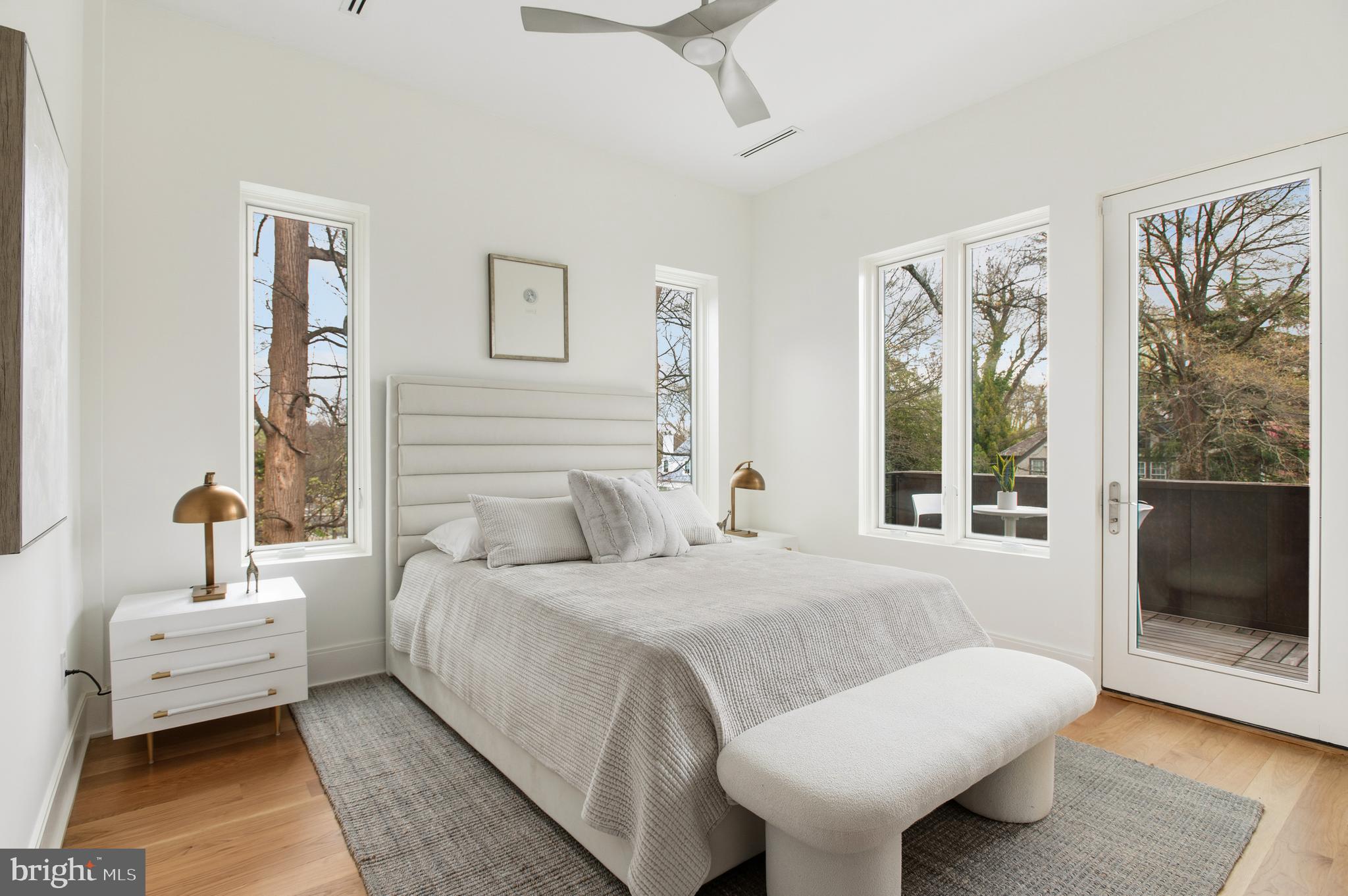 3001 Foxhall Road Northwest Washington, DC 20016 - Photo 31 of 51 a spacious bedroom with a bed and wooden floor