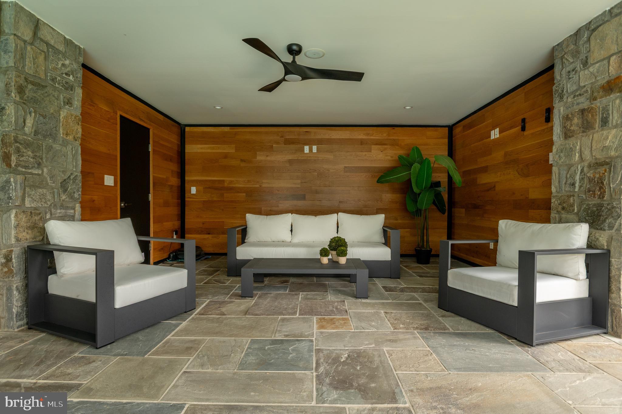 3001 Foxhall Road Northwest Washington, DC 20016 - Photo 43 of 51 a living room with furniture and a ceiling fan