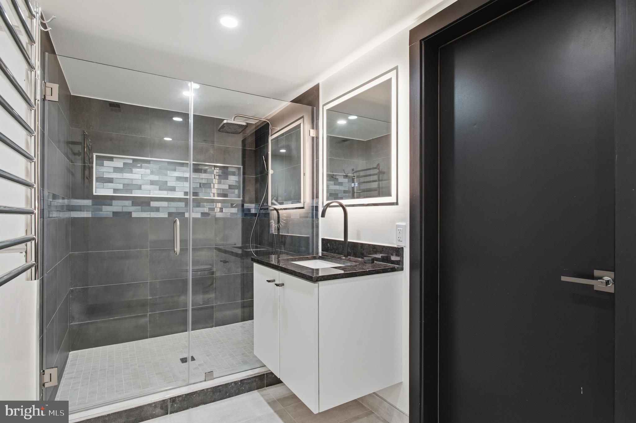 3001 Foxhall Road Northwest Washington, DC 20016 - Photo 44 of 51 a bathroom with a shower and a sink