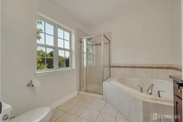 a bathroom with a bathtub and toilet