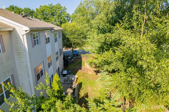 a aerial view of a house with a yard