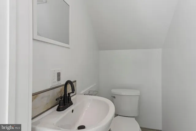 a bathroom with a sink and a toilet