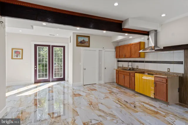 a kitchen with stainless steel appliances granite countertop a stove and a sink