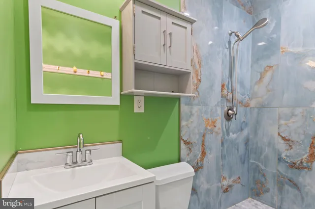 a bathroom with a sink a toilet and a bathtub