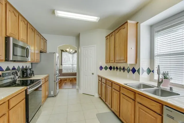a large bathroom with double vanity and a bathtub