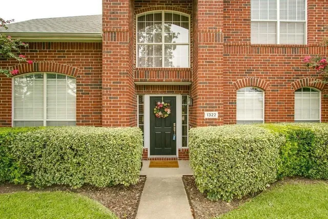 a front view of a house having yard