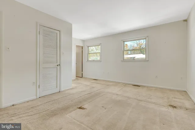 an empty room with windows