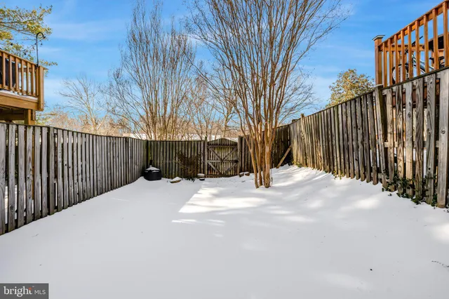 a view of a backyard of the house