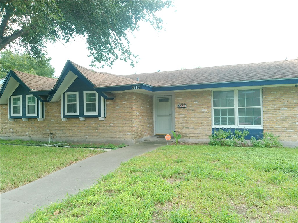 4117 Monaco Street Corpus Christi, TX 78411 - Photo 1 of 17 a view of a house with a yard and a large tree