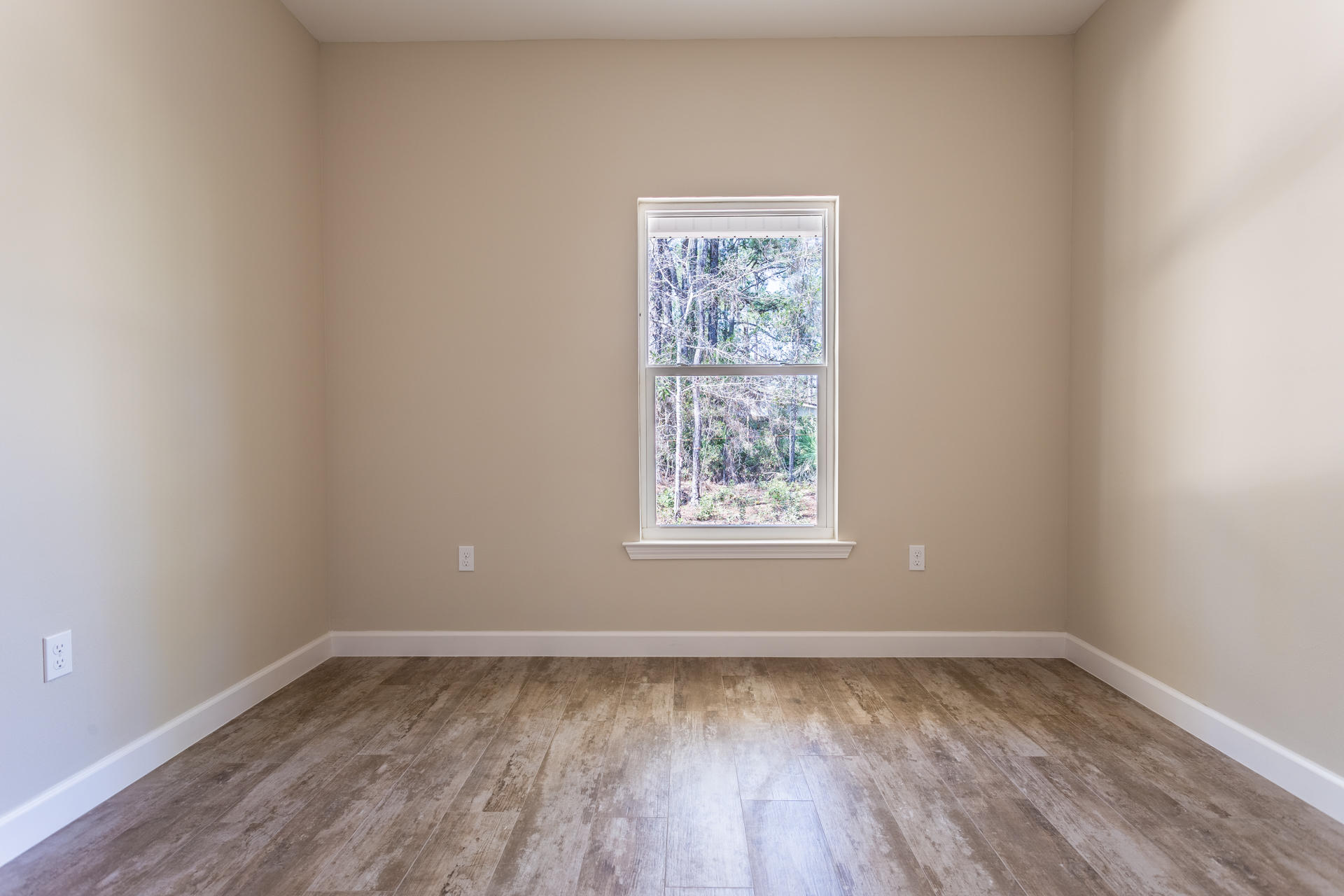 343 Indian Woman Road Santa Rosa Beach, FL 32459 - Photo 19 of 21 a view of a room with wooden floor and window