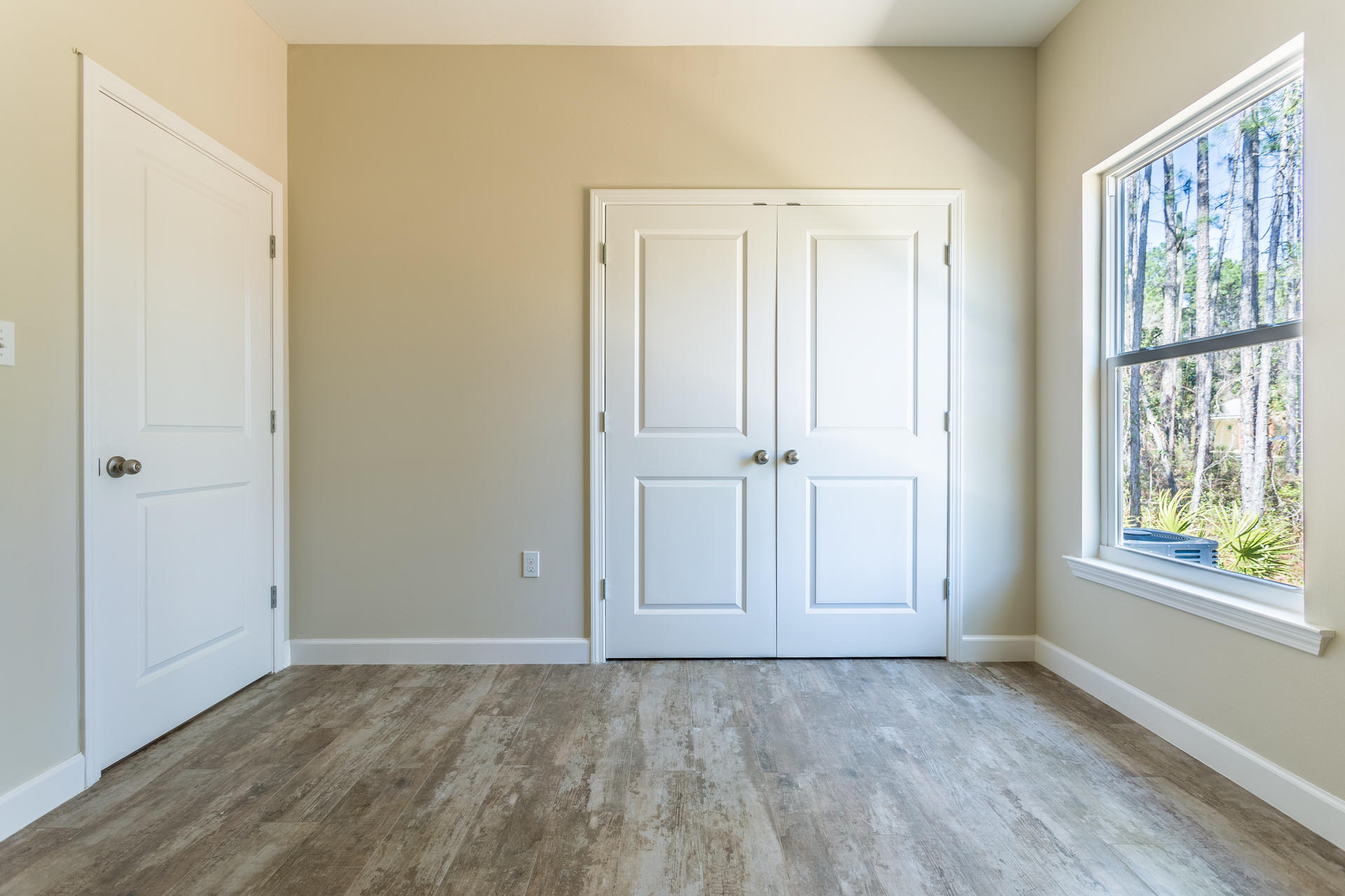 343 Indian Woman Road Santa Rosa Beach, FL 32459 - Photo 7 of 21 a view of an empty room with window and door
