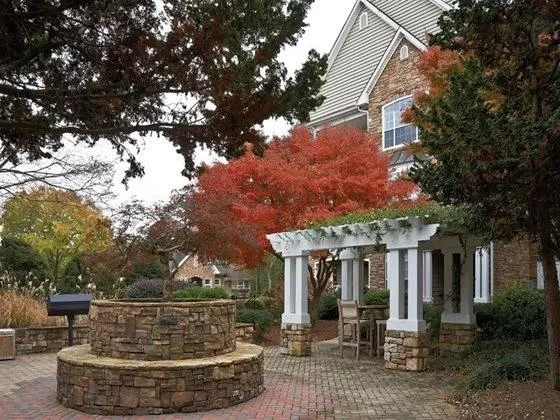 a view of a house with a fountain