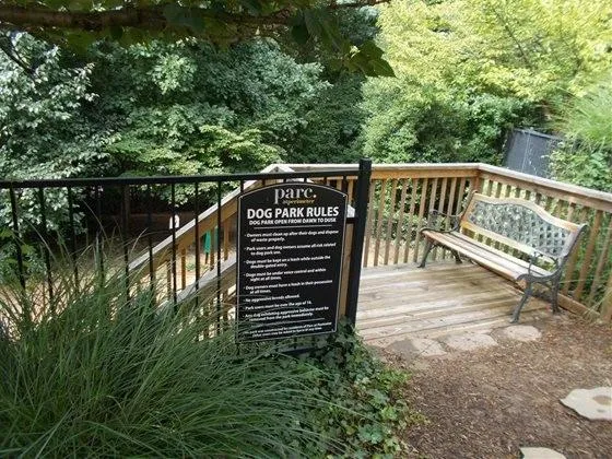 a balcony with wooden floor and outdoor space
