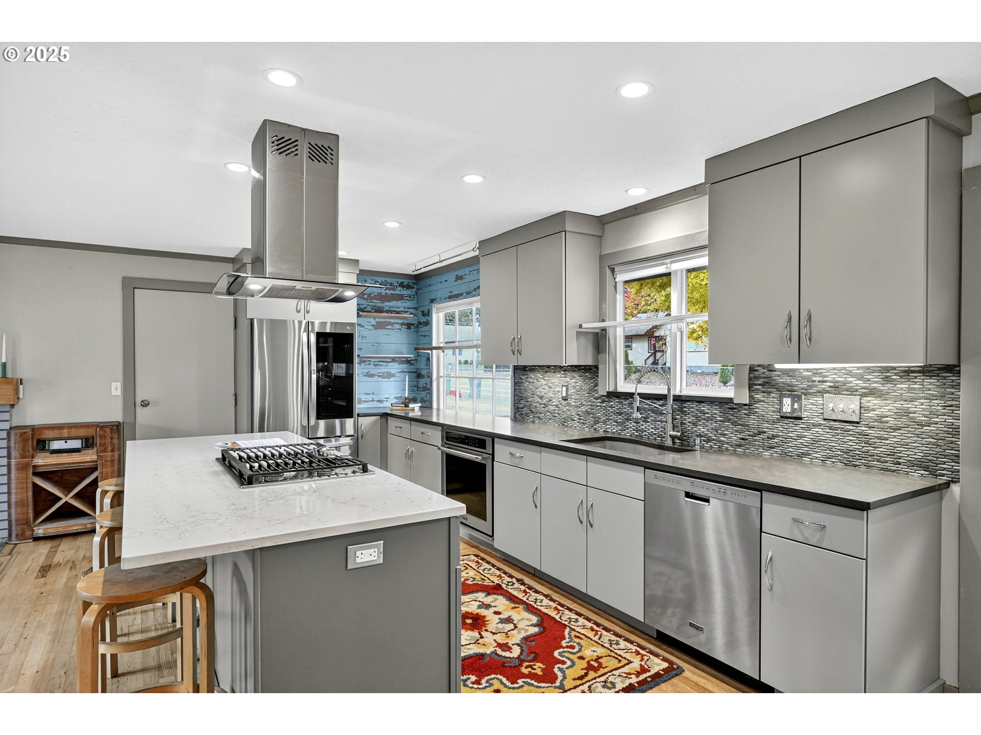 830 Northeast 172nd Avenue Portland, OR 97230 - Photo 12 of 31 a kitchen with stainless steel appliances kitchen island granite countertop a sink and cabinets