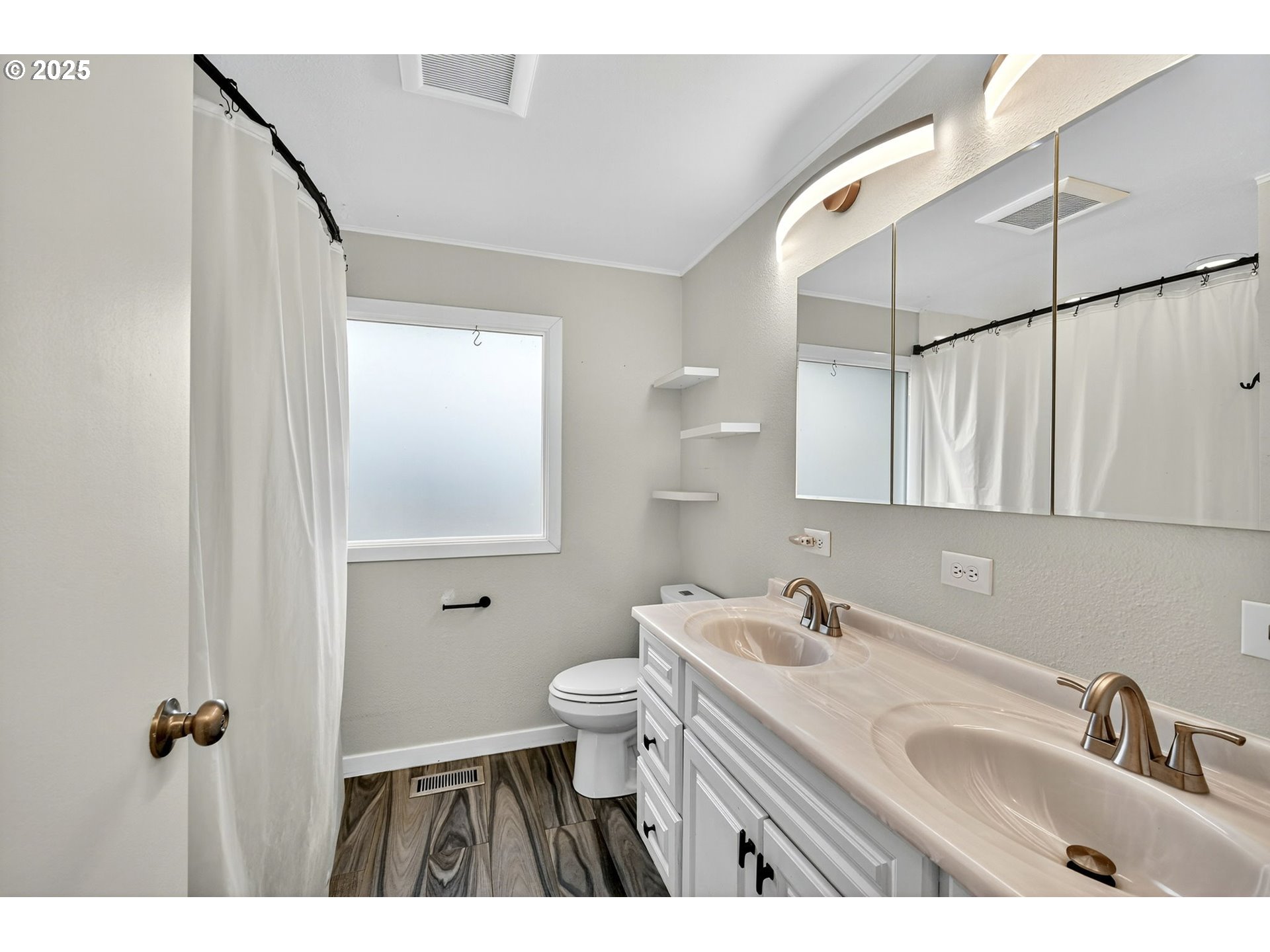 830 Northeast 172nd Avenue Portland, OR 97230 - Photo 16 of 31 a bathroom with a sink toilet and mirror