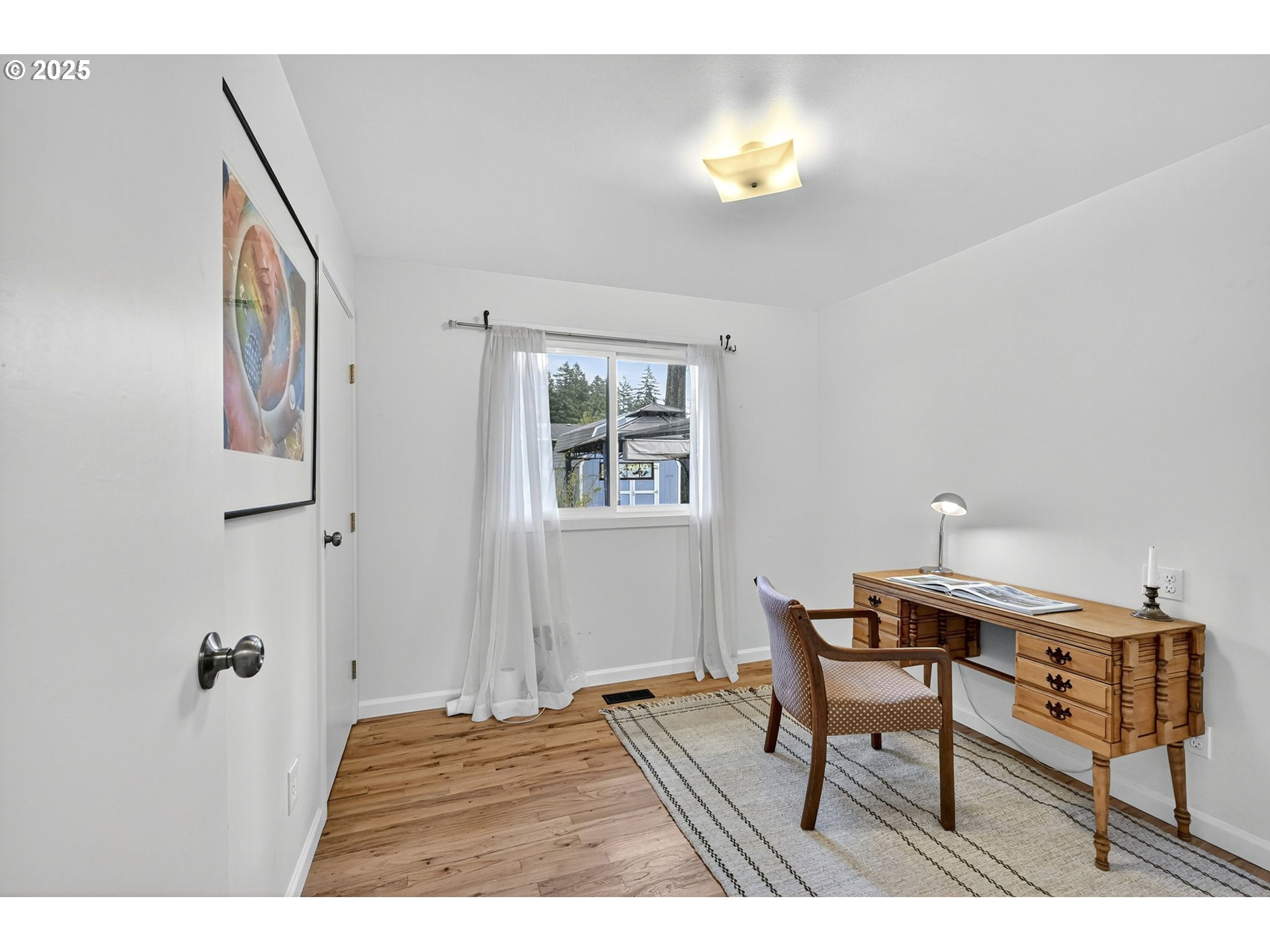 830 Northeast 172nd Avenue Portland, OR 97230 - Photo 17 of 31 a workspace with furniture and lamp