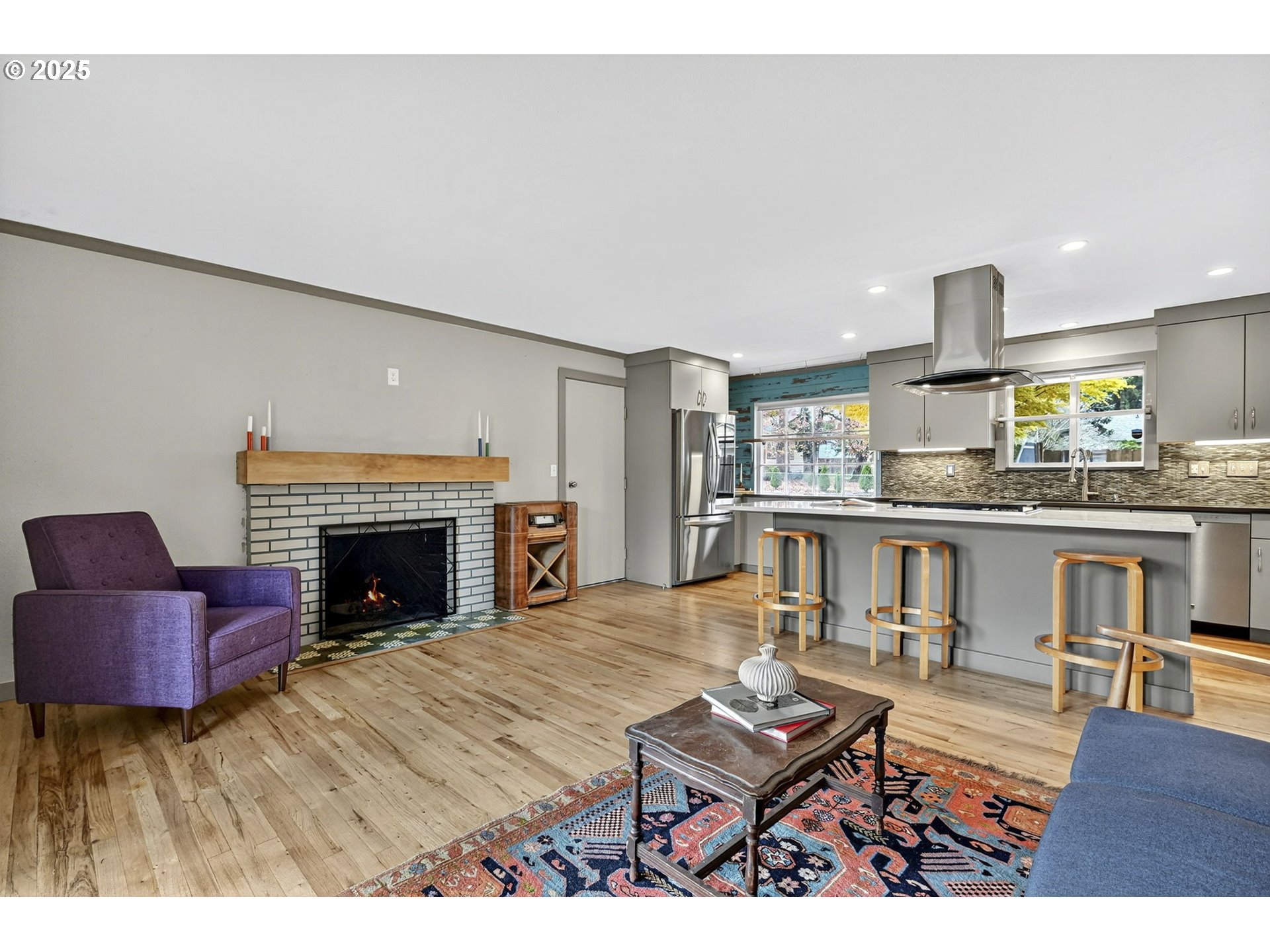 830 Northeast 172nd Avenue Portland, OR 97230 - Photo 9 of 31 a living room with furniture and a fireplace