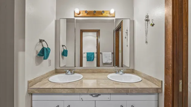 a bedroom with furniture and a flat screen tv