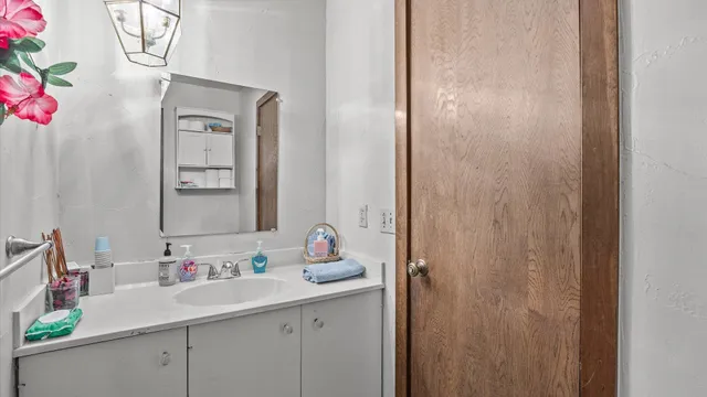 a bathroom with a sink and a mirror