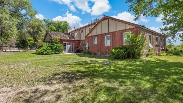 a view of a field with an trees
