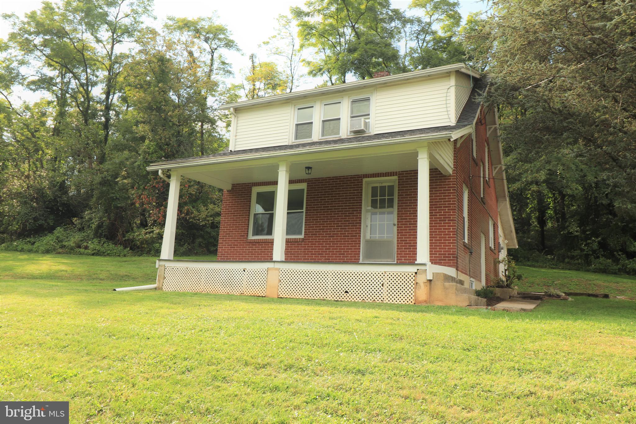 678 Rockville Road Spring Grove, PA 17362 - Photo 1 of 32 a front view of a house with a yard