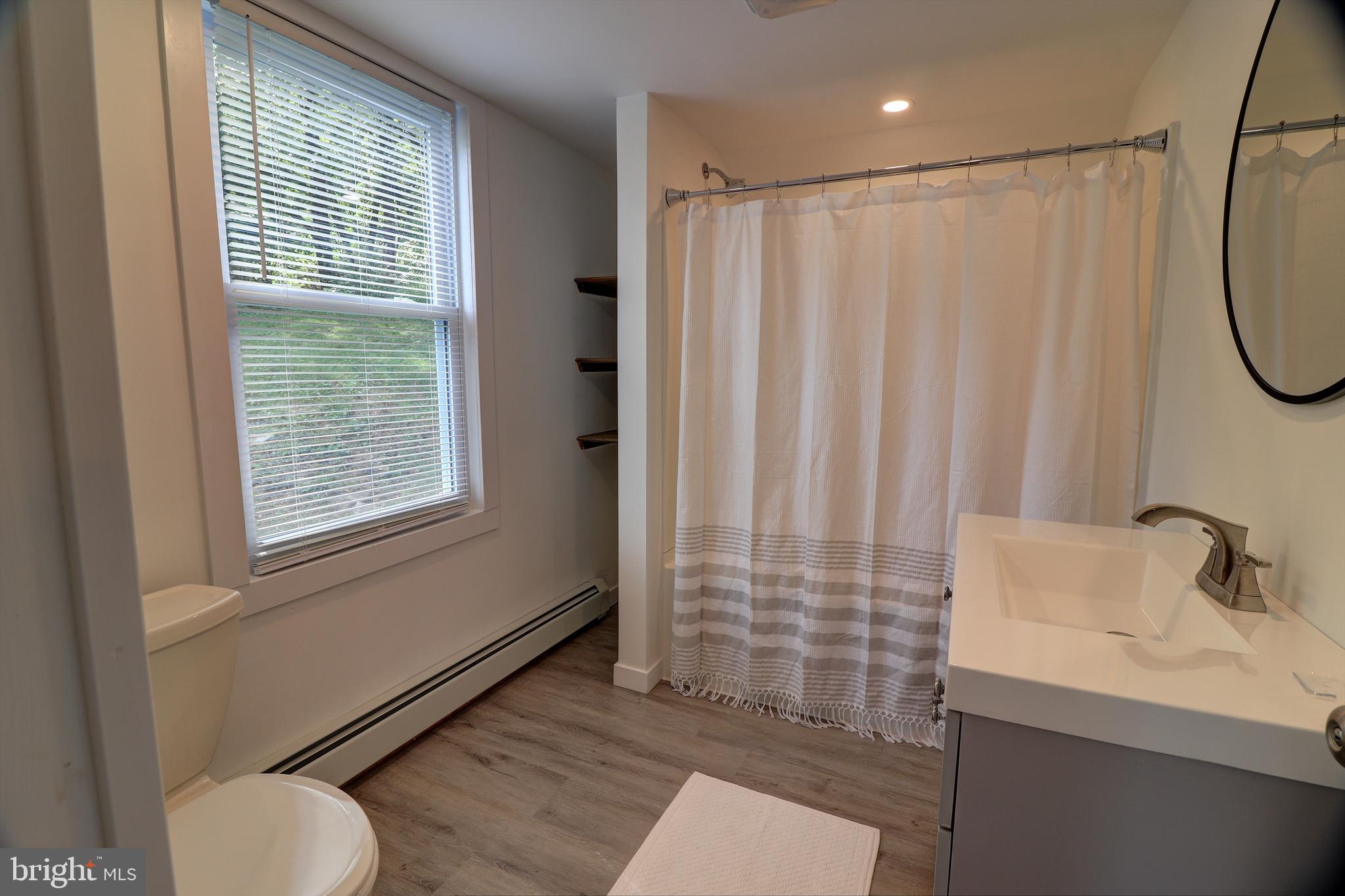 678 Rockville Road Spring Grove, PA 17362 - Photo 12 of 32 a bathroom with a sink and a mirror