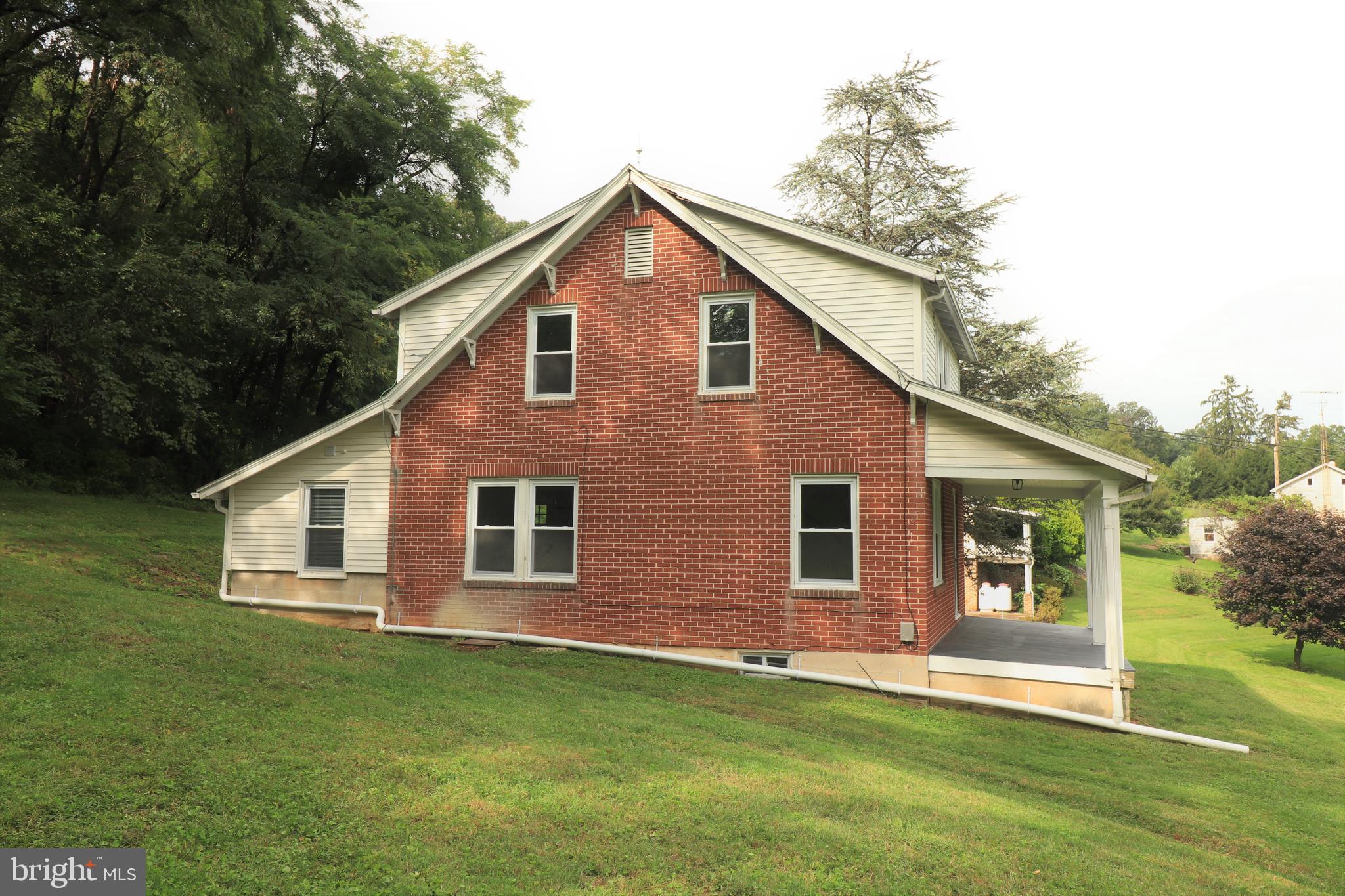 678 Rockville Road Spring Grove, PA 17362 - Photo 24 of 32 a front view of a house with a yard