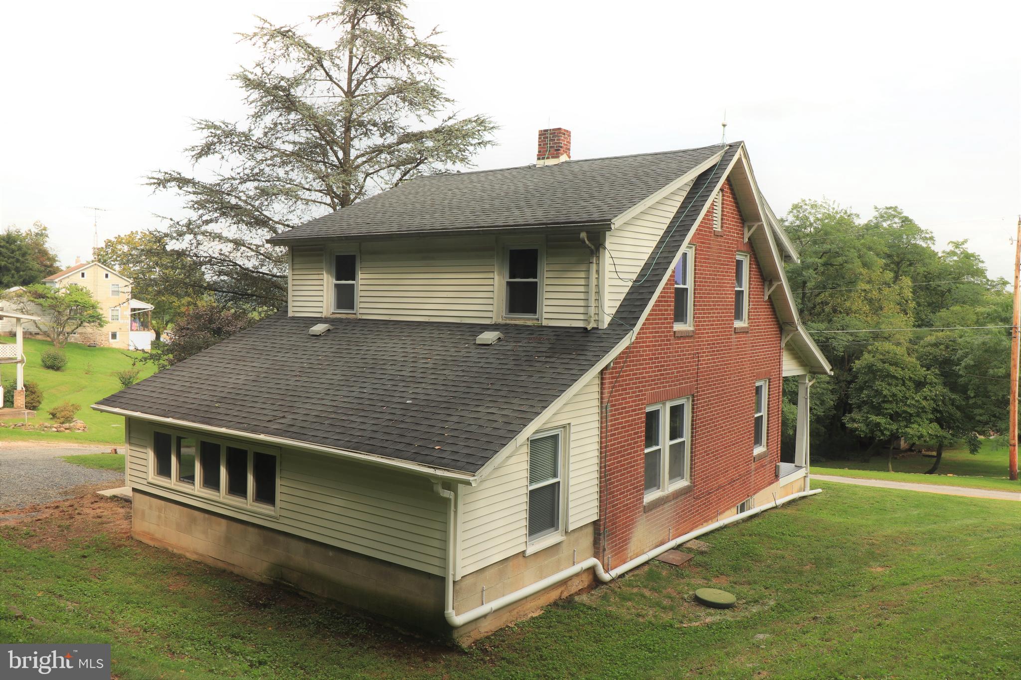678 Rockville Road Spring Grove, PA 17362 - Photo 26 of 32 a front view of house with yard and trees in the background
