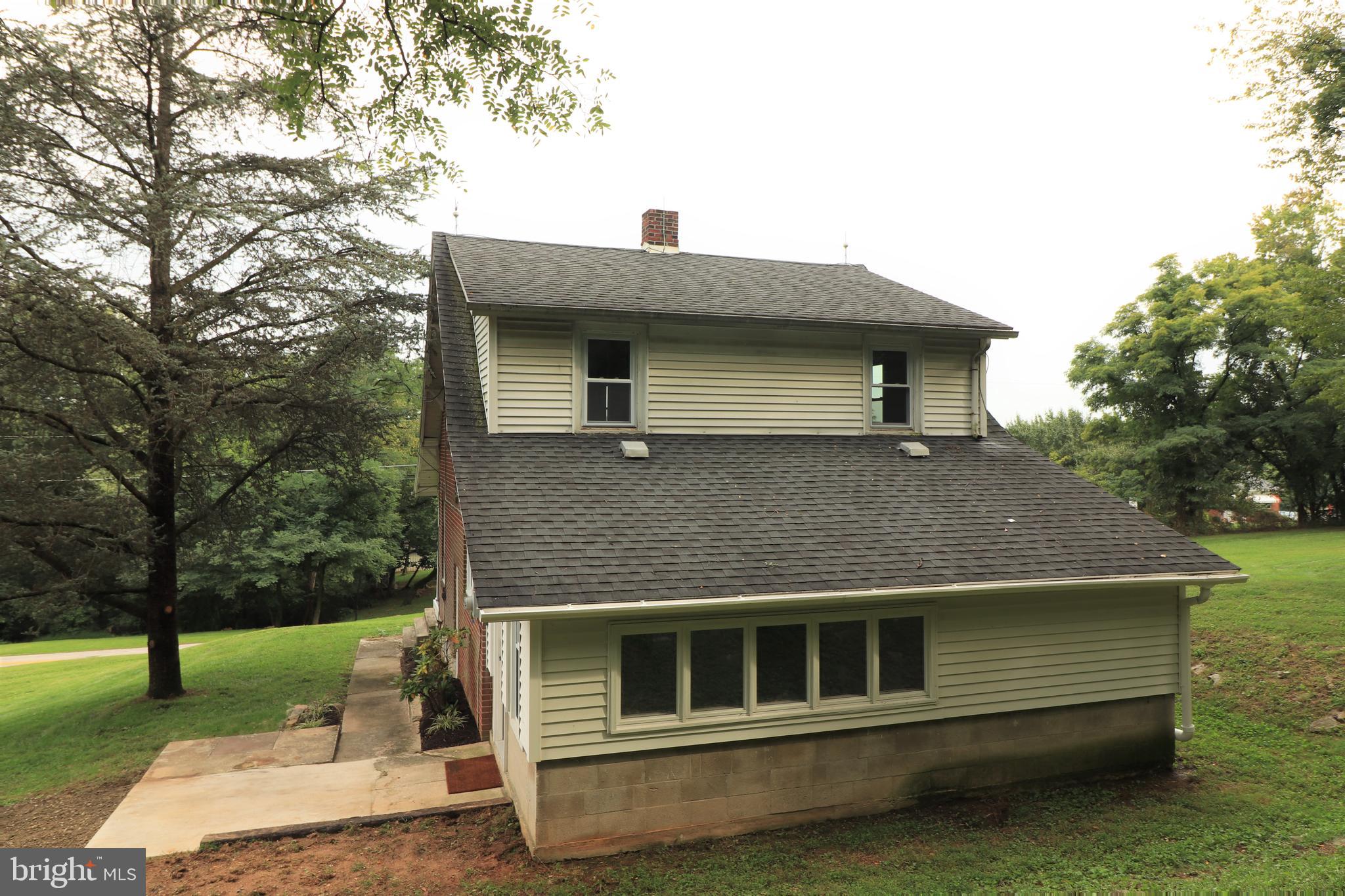 678 Rockville Road Spring Grove, PA 17362 - Photo 27 of 32 a front view of a house with garden