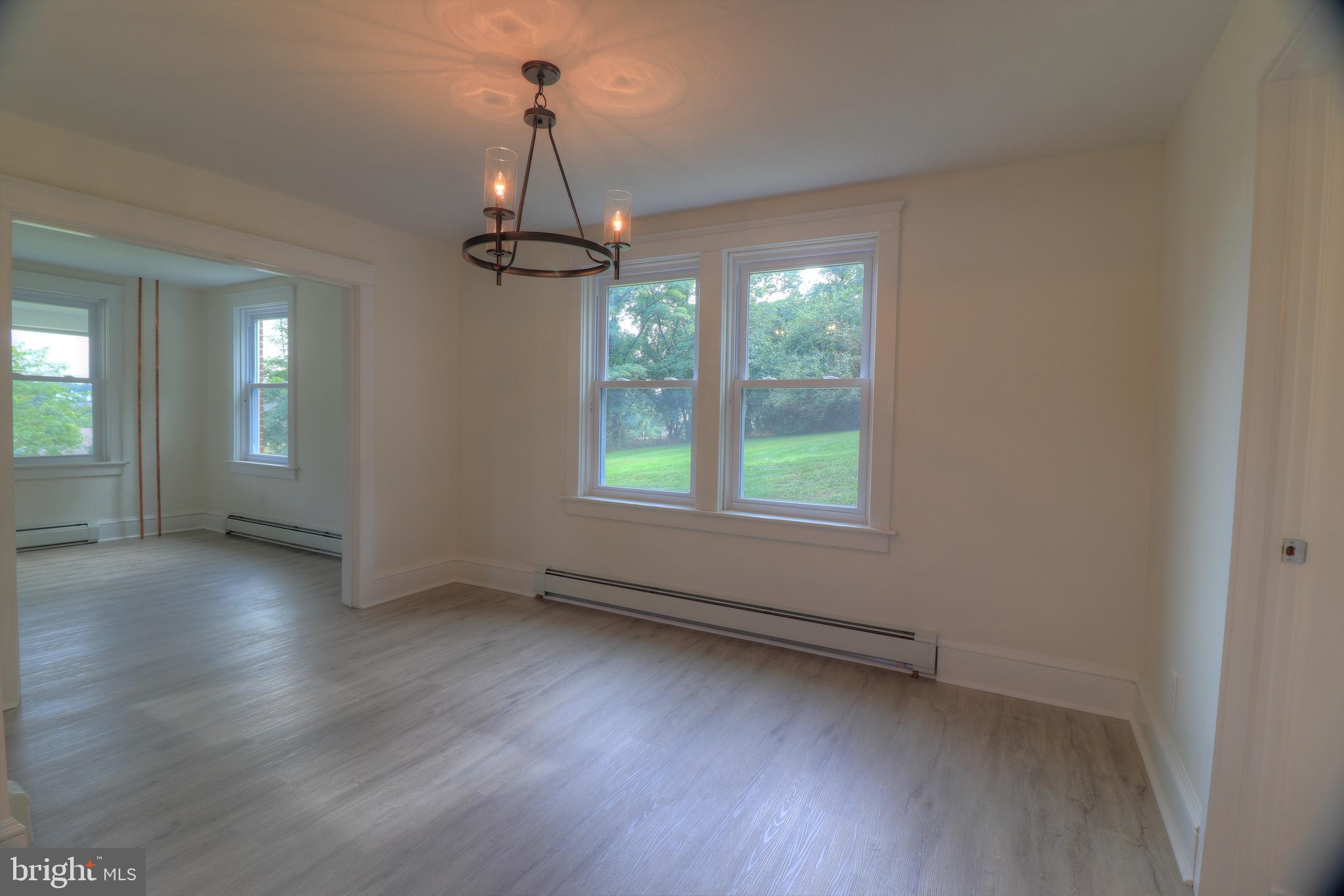 678 Rockville Road Spring Grove, PA 17362 - Photo 5 of 32 wooden floor in an empty room with a window