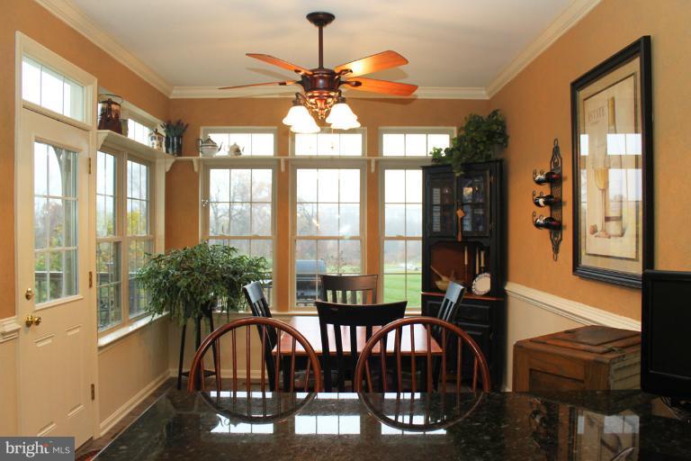 2438 Rippling Brook Road Frederick, MD 21701 - Photo 14 of 24 a view of a dining room with furniture window and outside view