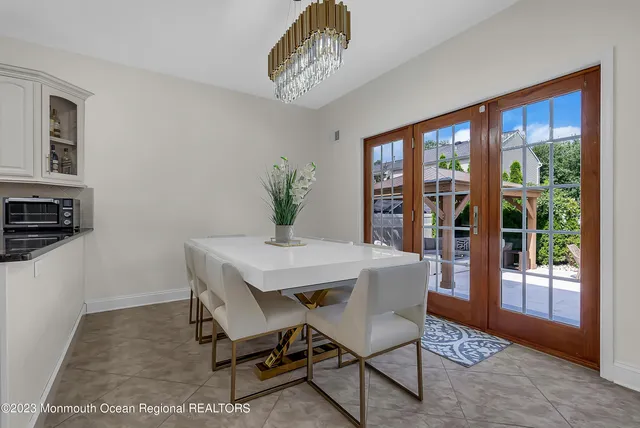 a kitchen with a table and chairs in it
