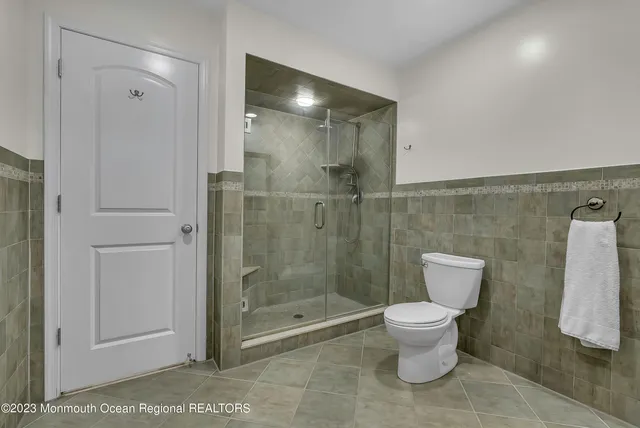 a bedroom with two beds and a window