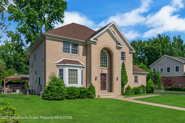 a front view of a house with a yard