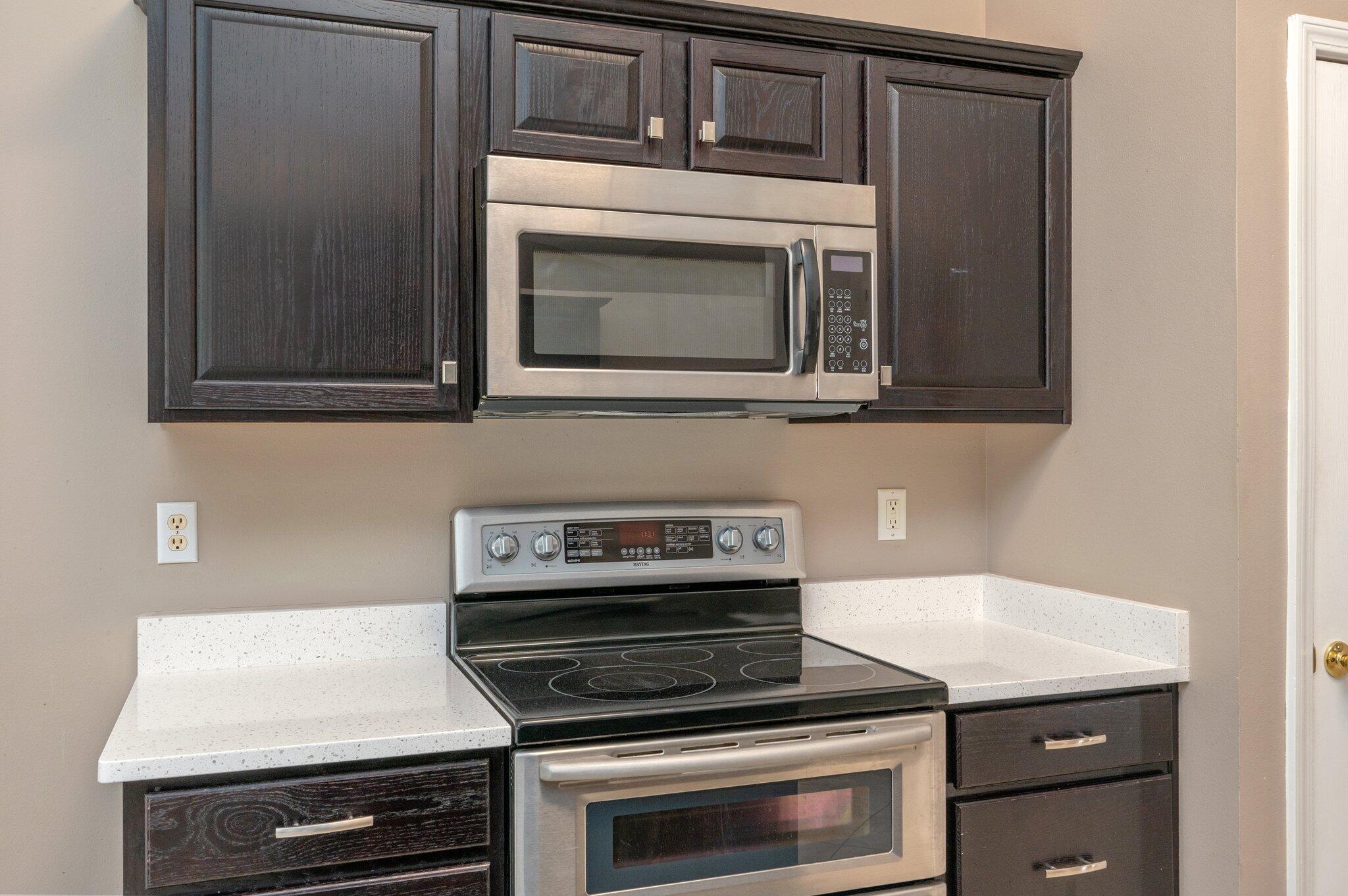 4752 Balboa Road Crestview, FL 32539 - Photo 14 of 46 a kitchen with appliances and cabinets